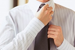 man tying a tie